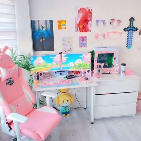 pink gaming desk setup on a tiny desk