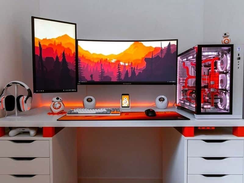 red and white gaming setup with a water cooled pc